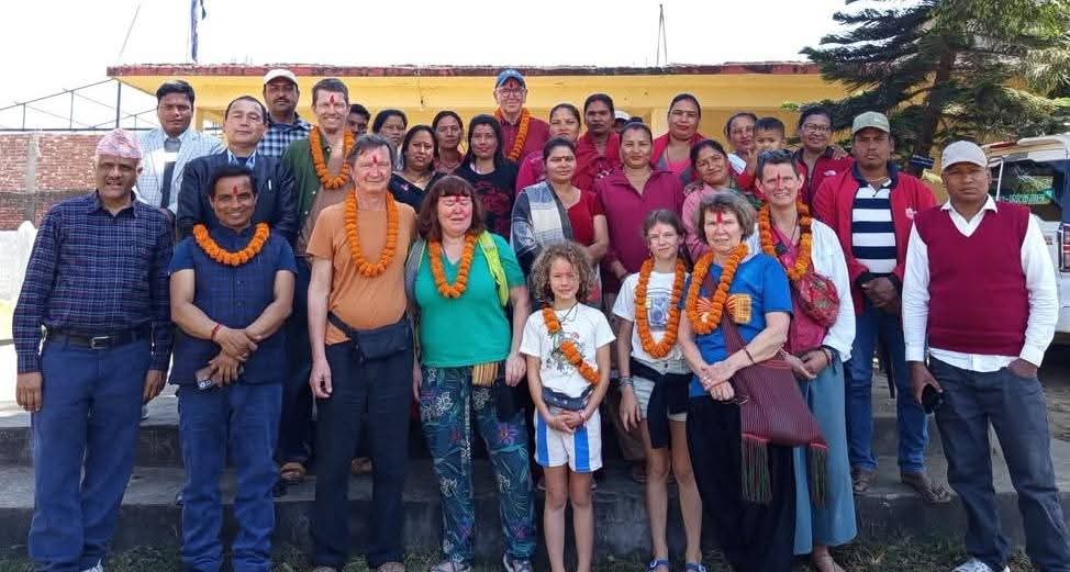 group of french people with nepali schools program for donations.